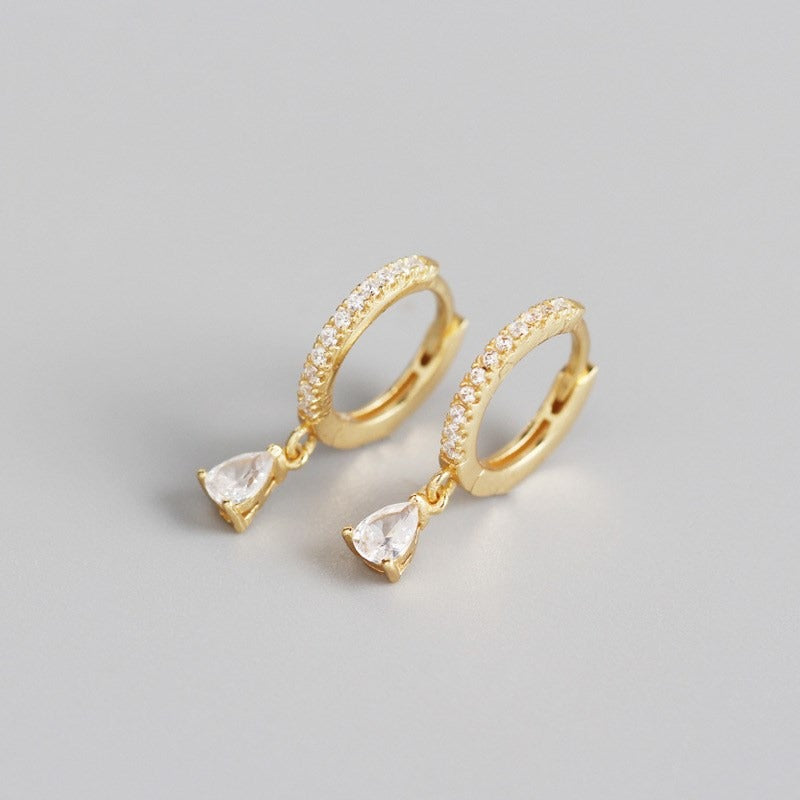 Gold tear earrings, casual design.