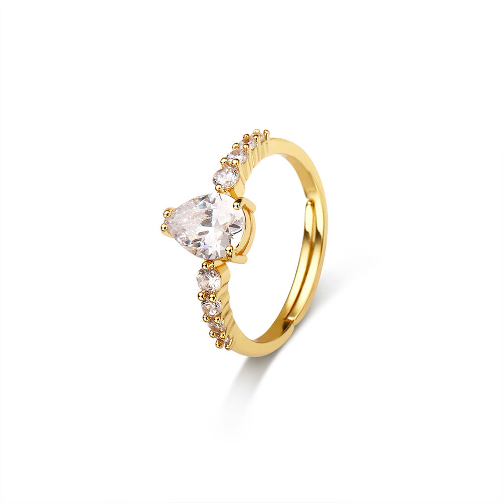 A gold ring with Oval and Side stones