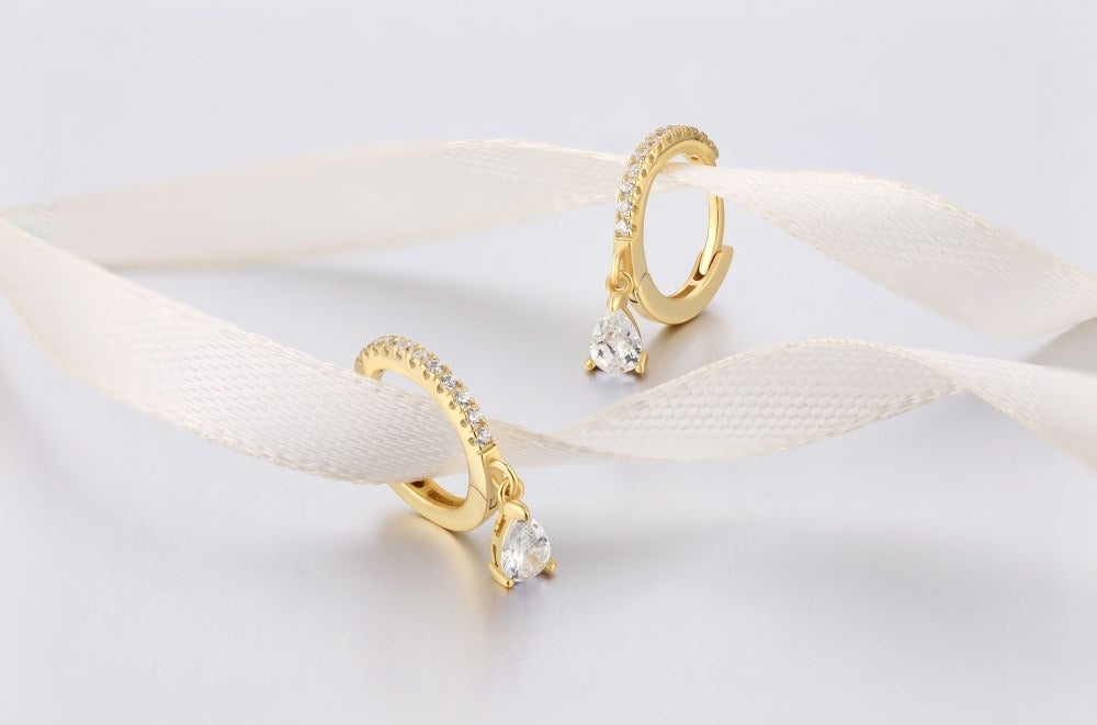 Gold tear earrings, casual design.